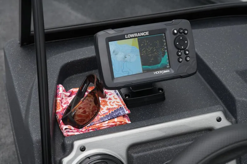 Slide: The Image of Fishfinder and sunglasses on 2025 Tracker Pro Guide™ V-175 WT boat dashboard. - 39