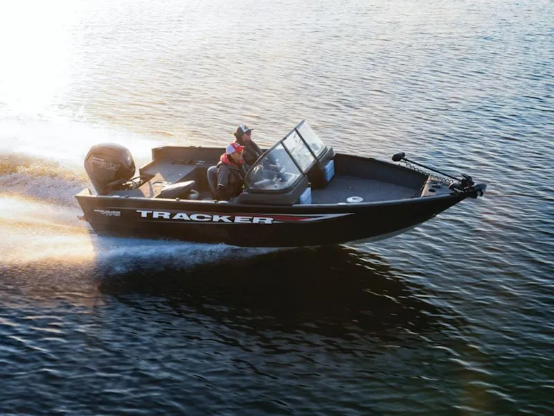 Slide: The Image of 2025 Tracker Pro Guide™ V-175 WT boat cruising on a sunlit lake. - 42