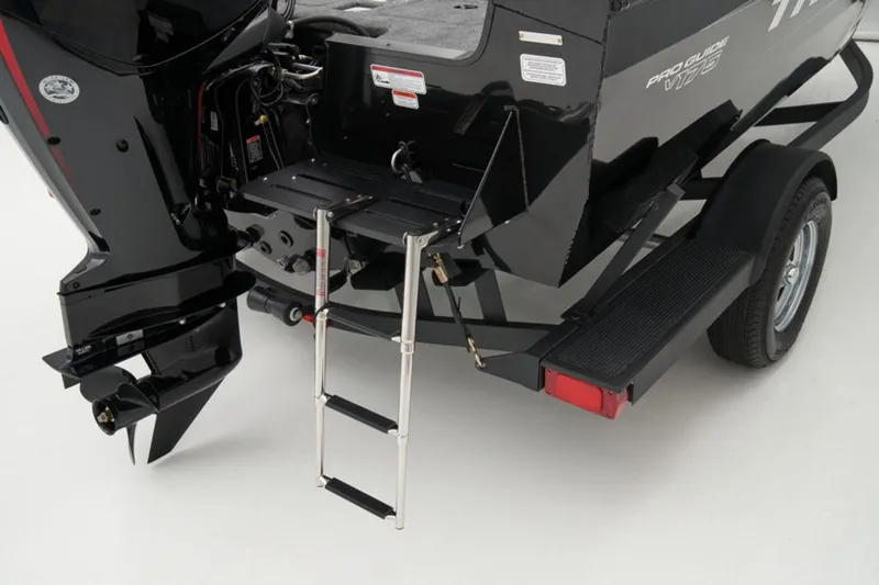 Slide: The Image of 2025 Tracker Pro Guide™ V-175 WT boat with ladder and motor, rear view. - 9