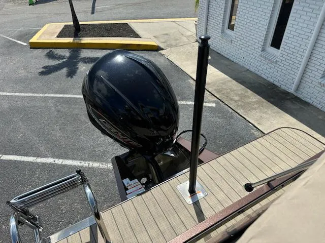 Slide: The Image of 2025 Veranda Relax VLC VR25VLC boat with outboard motor in parking lot. - 14