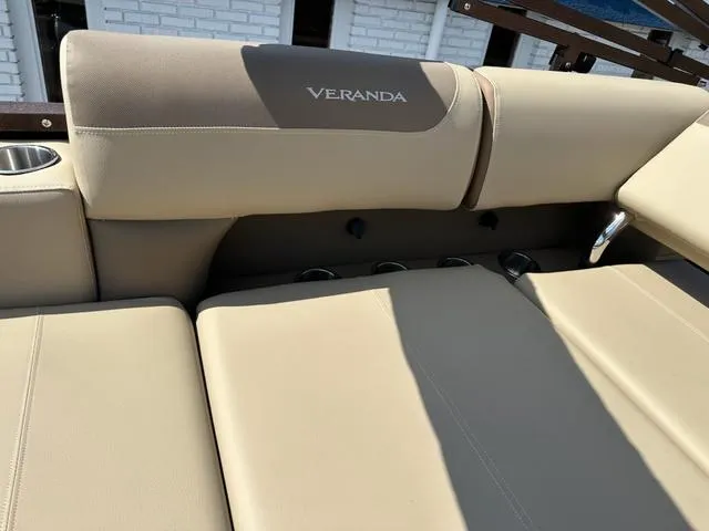 Slide: The Image of 2025 Veranda Relax VLC VR25VLC boat seating with beige upholstery and cup holder. - 15