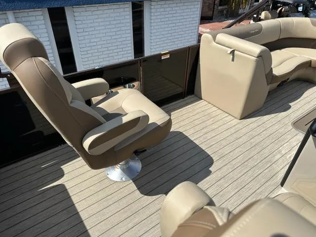 Slide: The Image of 2025 Veranda Relax VLC VR25VLC boat interior with beige seating and wood-style flooring. - 16