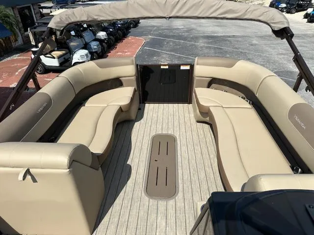 Slide: The Image of 2025 Veranda Relax VLC VR25VLC pontoon boat with spacious beige seating and canopy. - 17