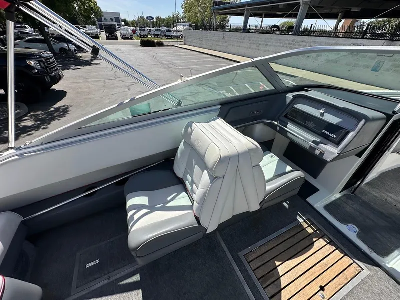 Slide: The Image of 1991 Cobalt Condurre 222 boat interior with white seating and dashboard. - 16