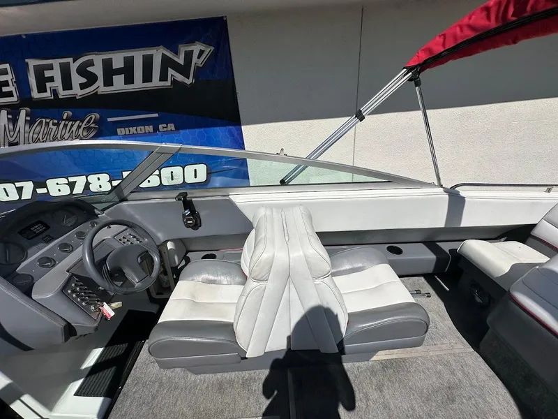 Slide: The Image of 1991 Cobalt Condurre 222 boat interior with steering wheel and seating. - 21