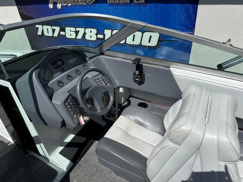 Slide: The Image of Interior of a 1991 Cobalt Condurre 222 boat with steering wheel and dashboard. - 22