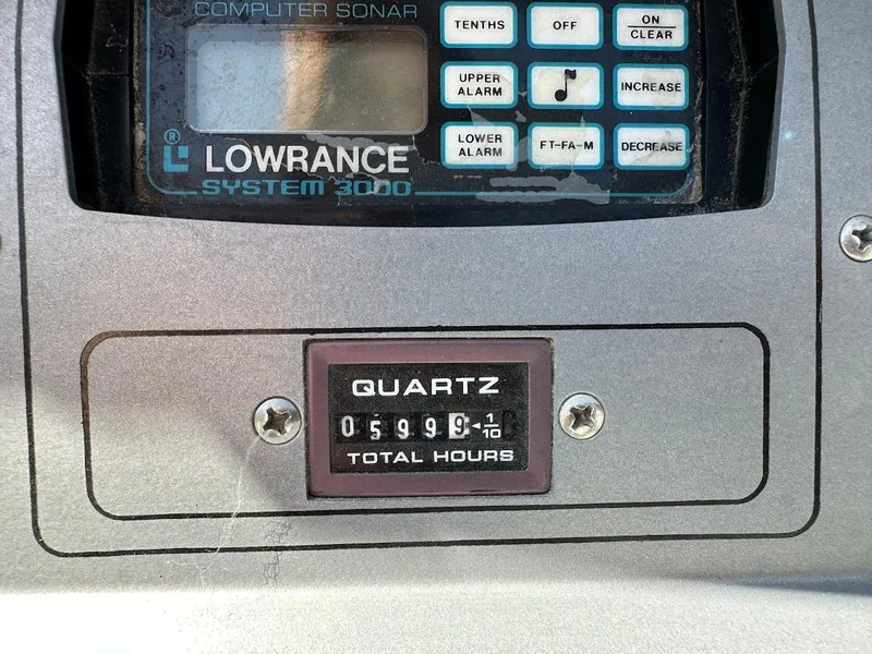Slide: The Image of Lowrance System 3000 sonar display and Quartz hour meter on 1991 Cobalt Condurre 222. - 25