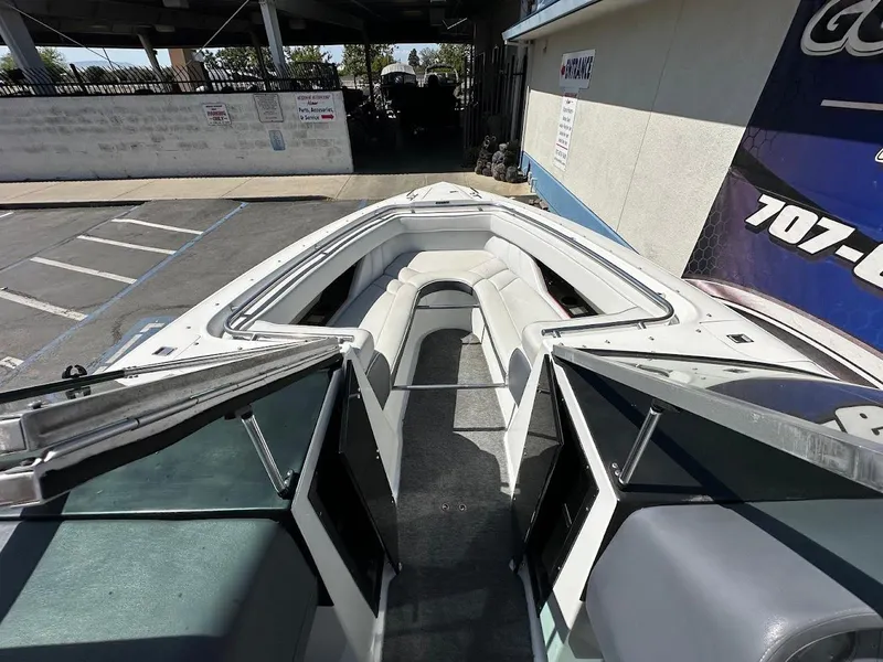 Slide: The Image of 1991 Cobalt Condurre 222 boat interior with white seating and open bow design. - 29