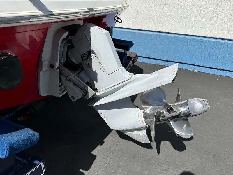 Slide: The Image of 1991 Cobalt Condurre 222 boat with outboard motor and propeller, parked on pavement. - 40