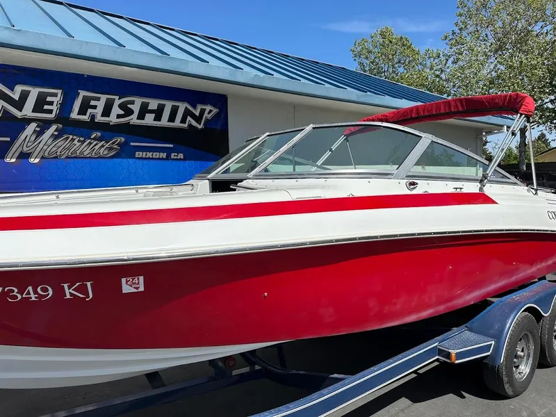 Slide: The Image of 1991 Cobalt Condurre 222 boat with red and white design on a trailer. - 7