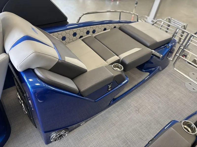 Slide: The Image of 2024 Manitou 25 XT SRS SHP boat interior with luxurious seating and modern design. - 17