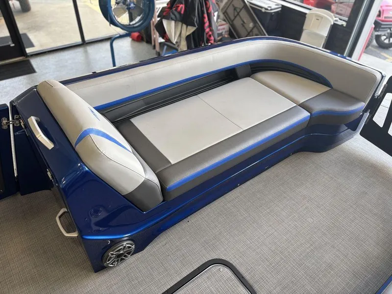 Slide: The Image of 2024 Manitou 25 XT SRS SHP boat seating, blue and gray upholstery, modern design. - 9