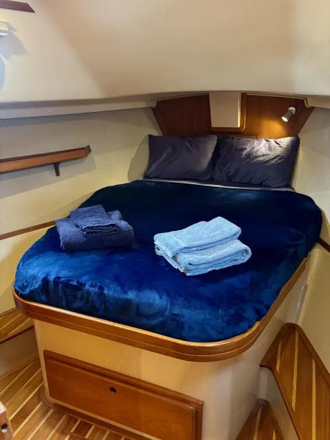 Slide: The Image of 2008 Island Packet 370 cabin with cozy bed and folded towels. - 15