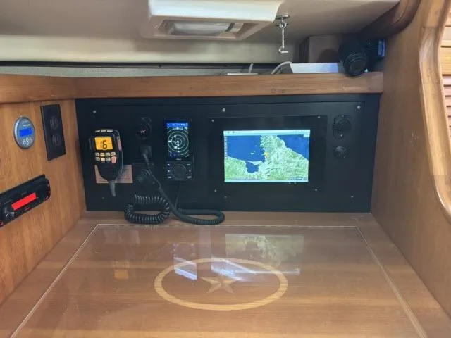 Slide: The Image of Navigation station of 2008 Island Packet 370 sailboat with GPS and communication equipment. - 19