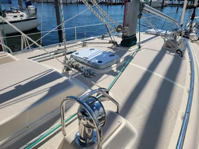 Slide: The Image of 2008 Island Packet 370 sailboat deck with winch and rigging in marina. - 23