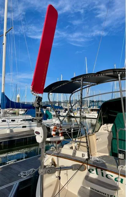 Slide: The Image of 2008 Island Packet 370 sailboat docked at marina with clear blue sky. - 27