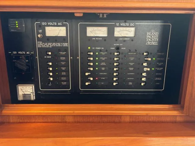 Slide: The Image of Electrical panel of a 2008 Island Packet 370 yacht, showing 120V AC and 12V DC systems. - 37