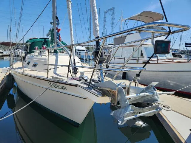 Slide: The Image of 2008 Island Packet 370 sailboat docked at marina, featuring sleek design and sturdy build. - 40