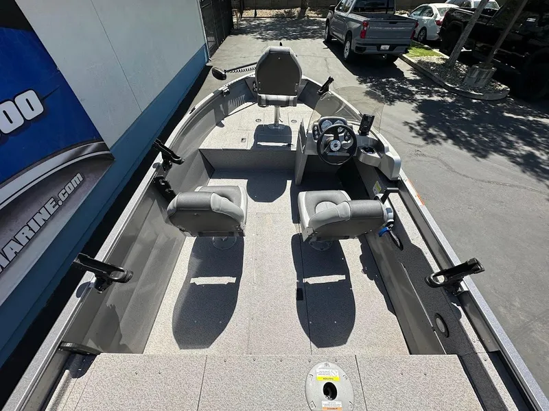 Slide: The Image of 2017 Crestliner 1600 Vision boat interior with seating and steering console. - 10