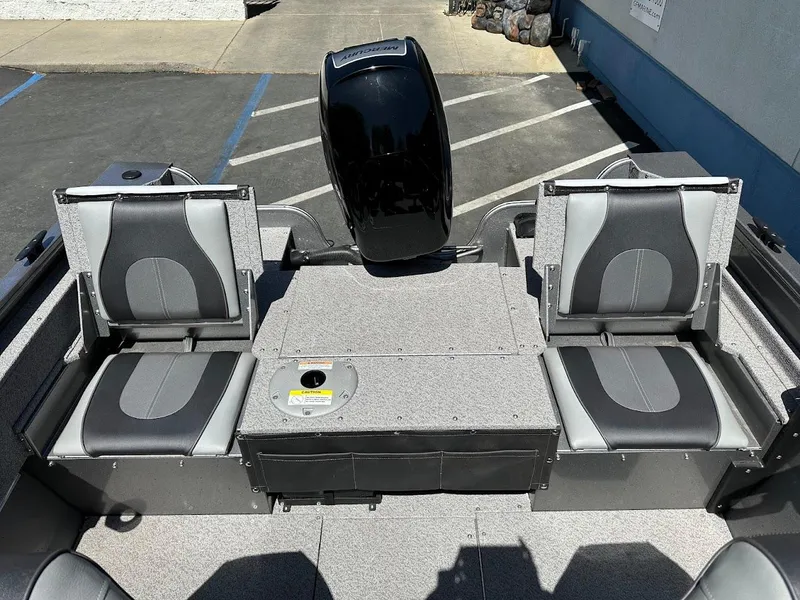 Slide: The Image of 2017 Crestliner 1600 Vision boat interior with dual seats and motor. - 15