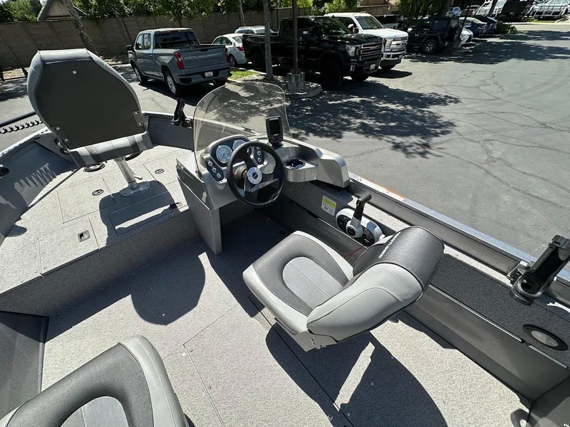 Slide: The Image of 2017 Crestliner 1600 Vision boat interior with steering console and seating. - 17