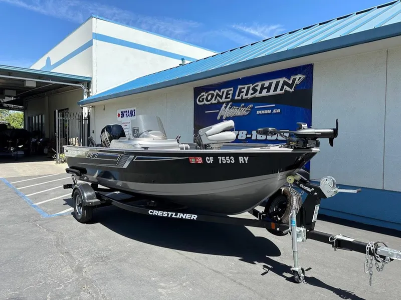 Slide: The Image of 2017 Crestliner 1600 Vision boat on trailer outside dealership. - 2