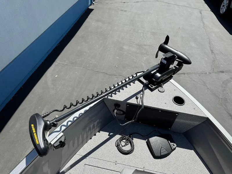 Slide: The Image of 2017 Crestliner 1600 Vision boat with trolling motor on deck. - 24