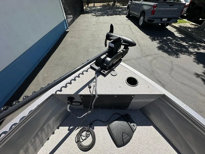 Slide: The Image of 2017 Crestliner 1600 Vision boat with trolling motor and foot pedal on deck. - 26