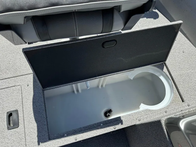 Slide: The Image of 2017 Crestliner 1600 Vision boat storage compartment with open lid, showcasing interior space. - 29