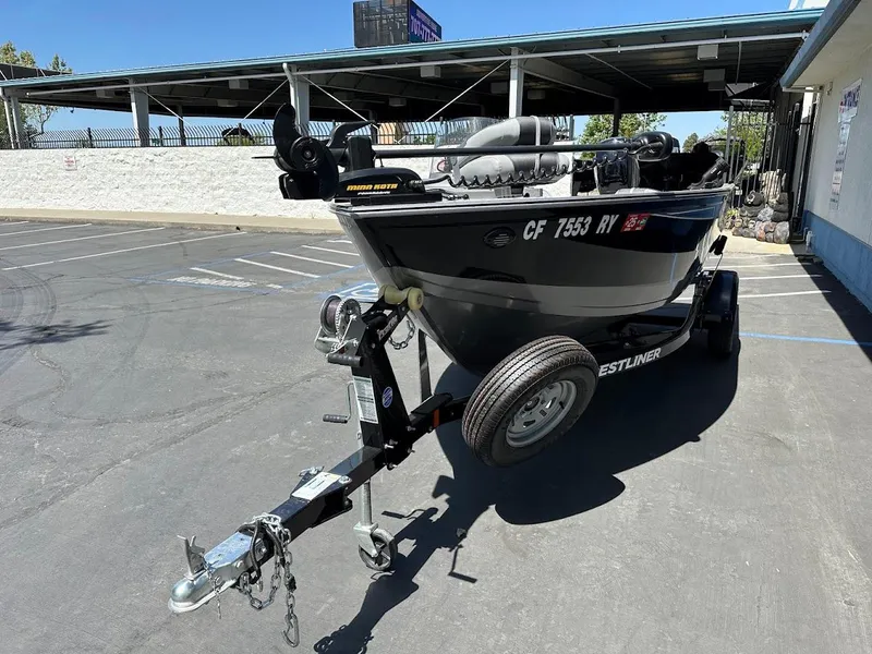 Slide: The Image of 2017 Crestliner 1600 Vision boat on trailer in parking lot. - 4