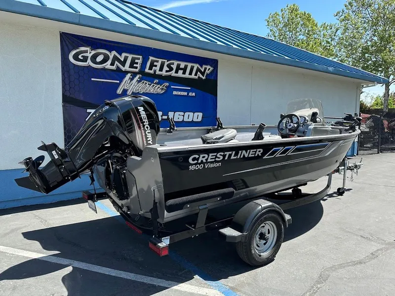 Slide: The Image of 2017 Crestliner 1600 Vision boat on trailer, parked outside a dealership. - 8