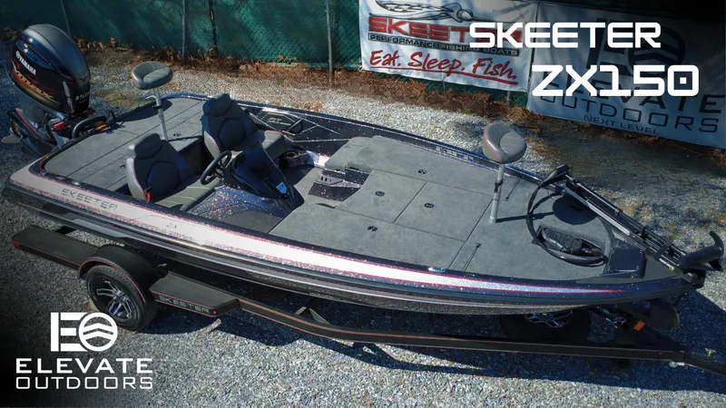 Slide: The Image of 2025 Skeeter ZX150 fishing boat on trailer, displayed outdoors with promotional banners. - 0