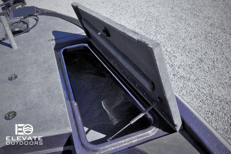 Slide: The Image of Open storage compartment on 2025 Skeeter ZX150 boat, featuring spacious interior and durable design. - 11