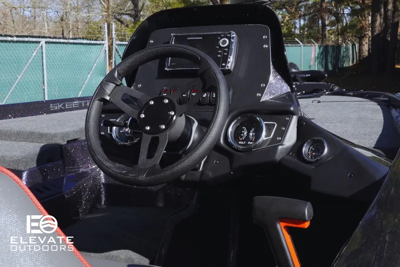 Slide: The Image of 2025 Skeeter ZX150 boat dashboard with steering wheel and control panel. - 14