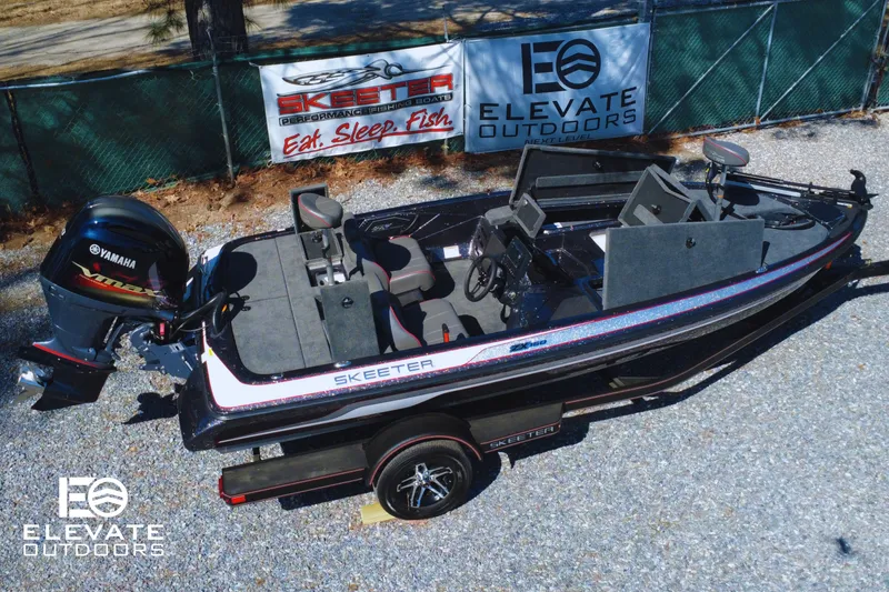 Slide: The Image of 2025 Skeeter ZX150 fishing boat with Yamaha motor, displayed outdoors with promotional banners. - 4