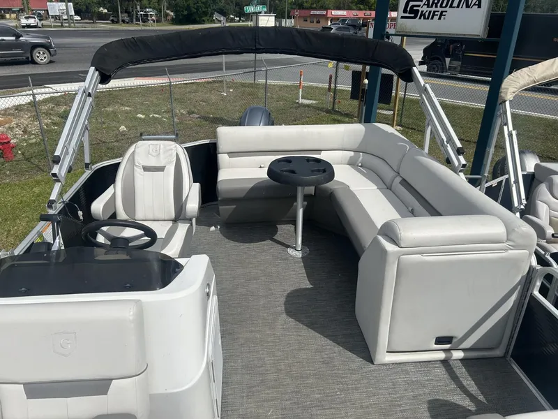 Slide: The Image of 2022 Sweetwater SW 1886 c pontoon boat interior with seating and table. - 11