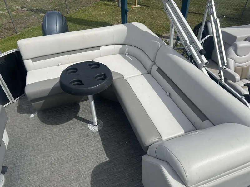 Slide: The Image of Luxurious Sweetwater SW 1886 c 2022 pontoon boat interior with plush seating and cupholder table. - 5