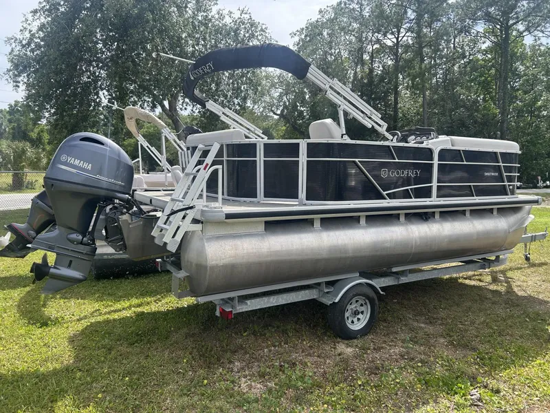 Slide: The Image of 2022 Sweetwater SW 1886 c pontoon boat with Yamaha motor on trailer. - 9