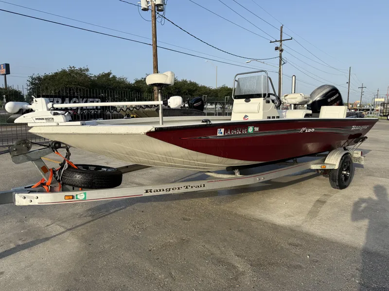 Slide: The Image of 2016 Ranger RP 190 boat on trailer, maroon and white, with Minn Kota motor. - 13