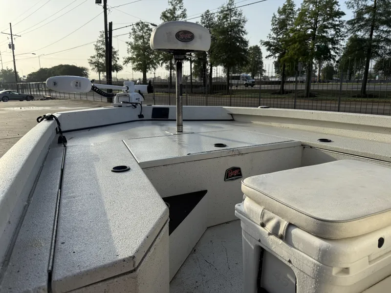 Slide: The Image of 2016 Ranger RP 190 boat interior with seating and equipment, parked outdoors. - 9