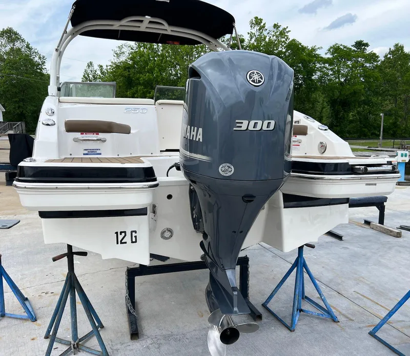 Slide: The Image of 2016 Chaparral 250 Suncoast boat with Yamaha 300 outboard engine on stands. - 21