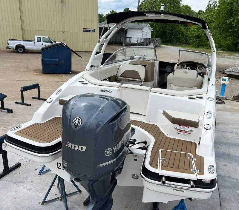 Slide: The Image of 2016 Chaparral 250 Suncoast boat with Yamaha 300 engine, docked outdoors. - 23