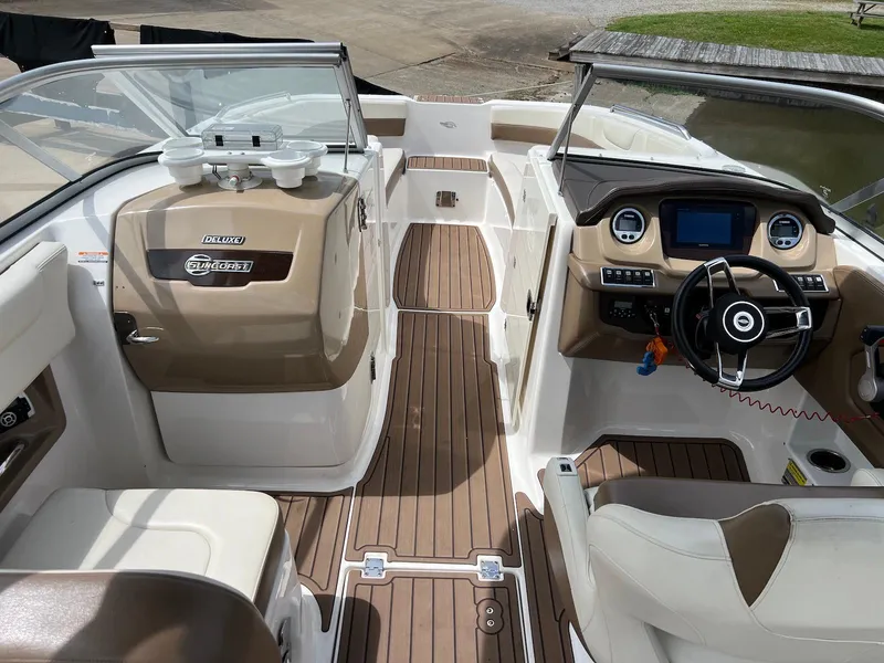 Slide: The Image of 2016 Chaparral 250 Suncoast boat interior with modern dashboard and seating. - 3