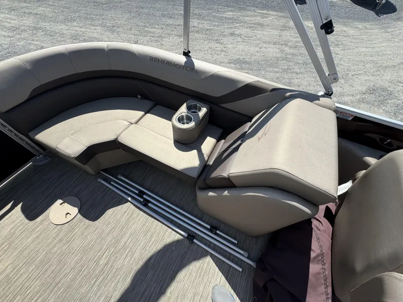 Slide: The Image of 2022 Bennington 22 SXSR boat interior with beige seating and cup holders. - 10