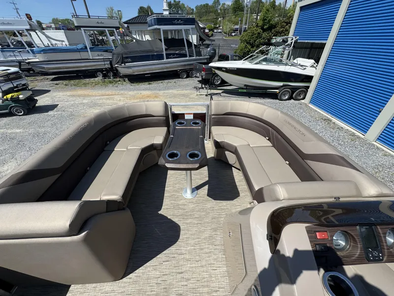 Slide: The Image of 2022 Bennington 22 SXSR pontoon boat interior with spacious seating and table. - 11
