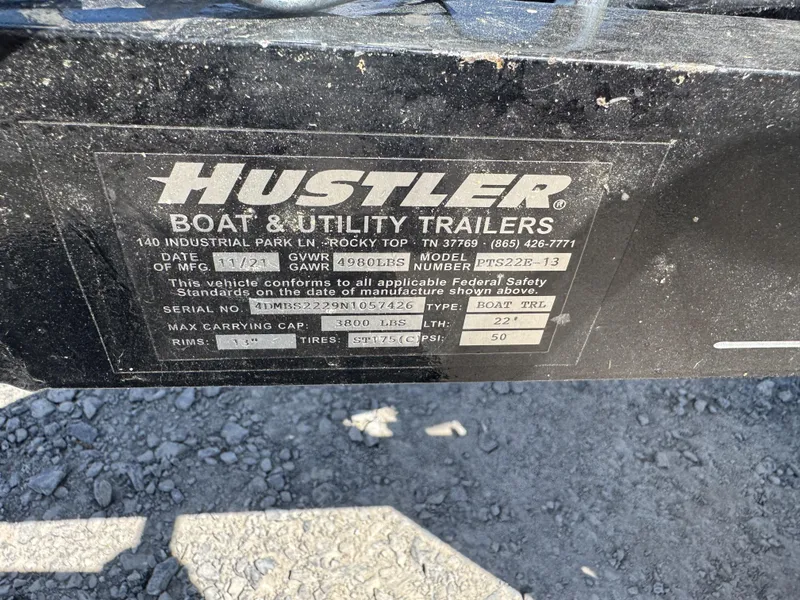 Slide: The Image of Label on Hustler boat trailer, model PTS22E-13, manufactured 11/21, max capacity 3800 lbs. - 13