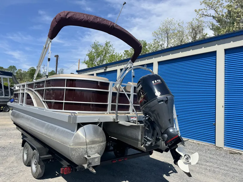 Slide: The Image of 2022 Bennington 22 SXSR pontoon boat with Yamaha 115 engine on trailer. - 16