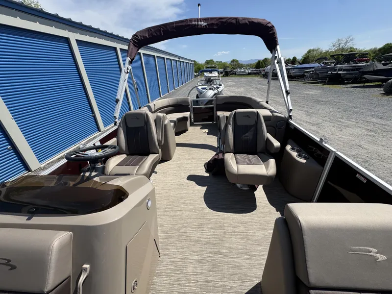 Slide: The Image of 2022 Bennington 22 SXSR pontoon boat with spacious seating and modern design. - 21