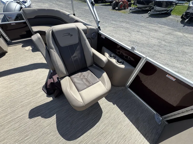 Slide: The Image of 2022 Bennington 22 SXSR boat interior with plush seating and cup holders. - 22
