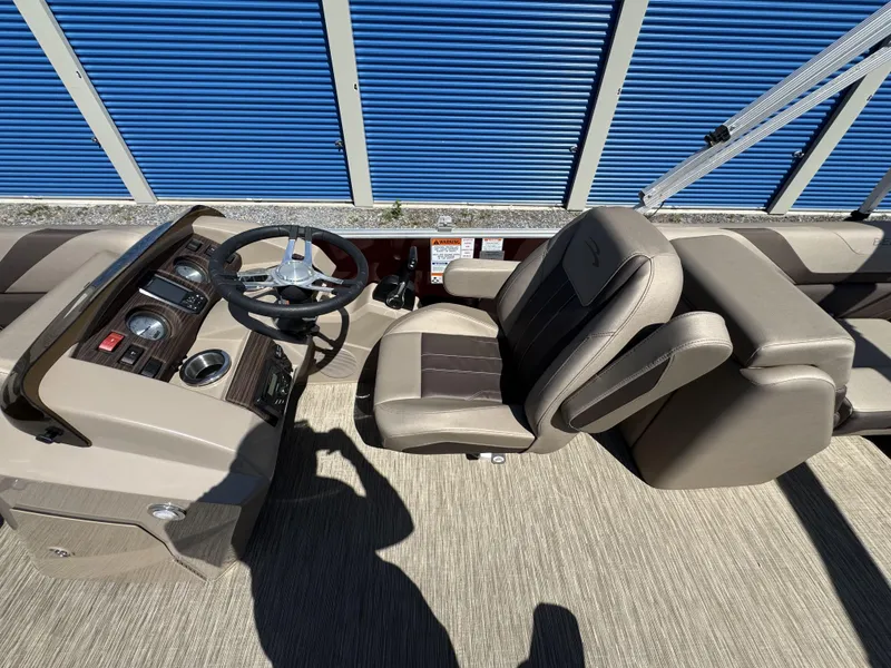 Slide: The Image of 2022 Bennington 22 SXSR boat interior with steering wheel and seating, featuring modern design elements. - 23